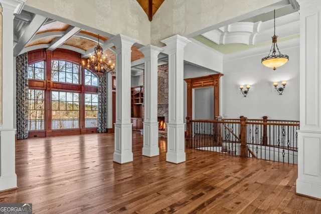 a view of walk in closet with window and wooden floor