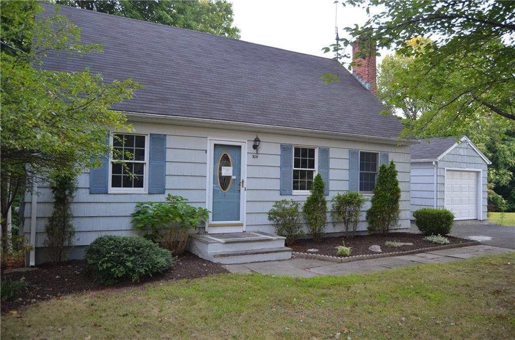 a view of a house with a yard and plants