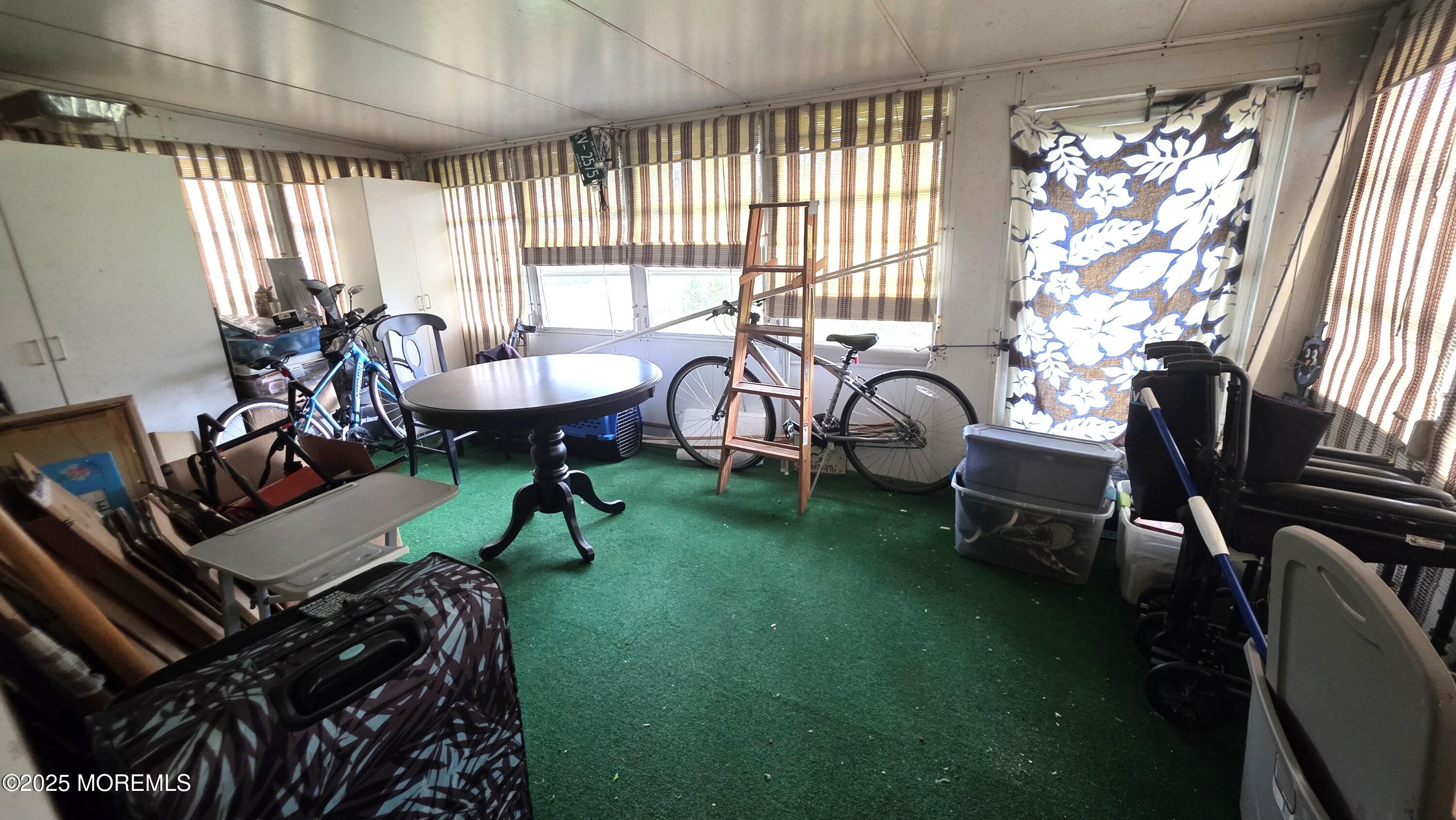 66 Breeze Court, Unit 97 Brick, NJ 08724 - Photo 13 of 18 a living room with furniture and a large window