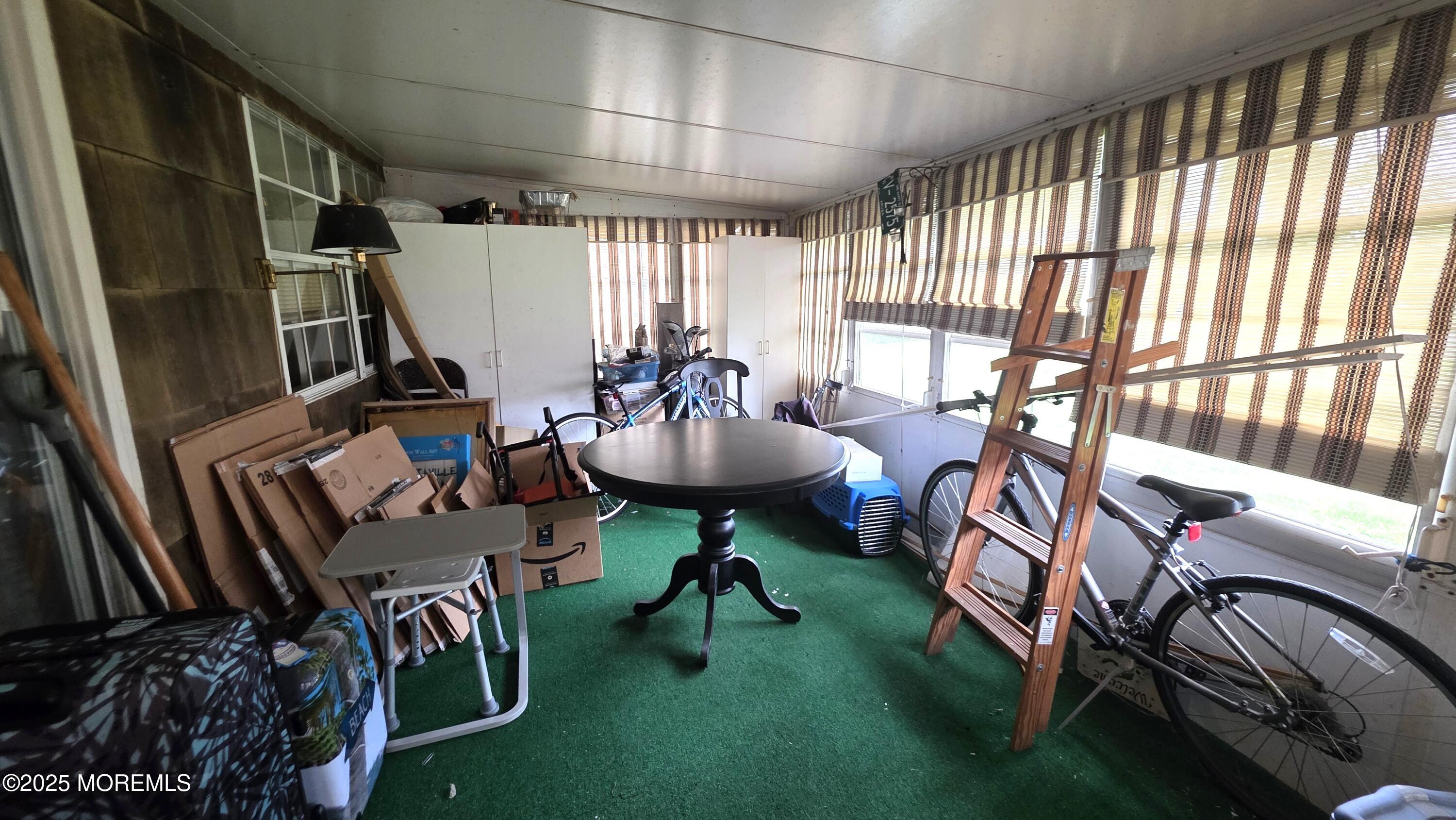 66 Breeze Court, Unit 97 Brick, NJ 08724 - Photo 14 of 18 a view of a livingroom with furniture and a rug