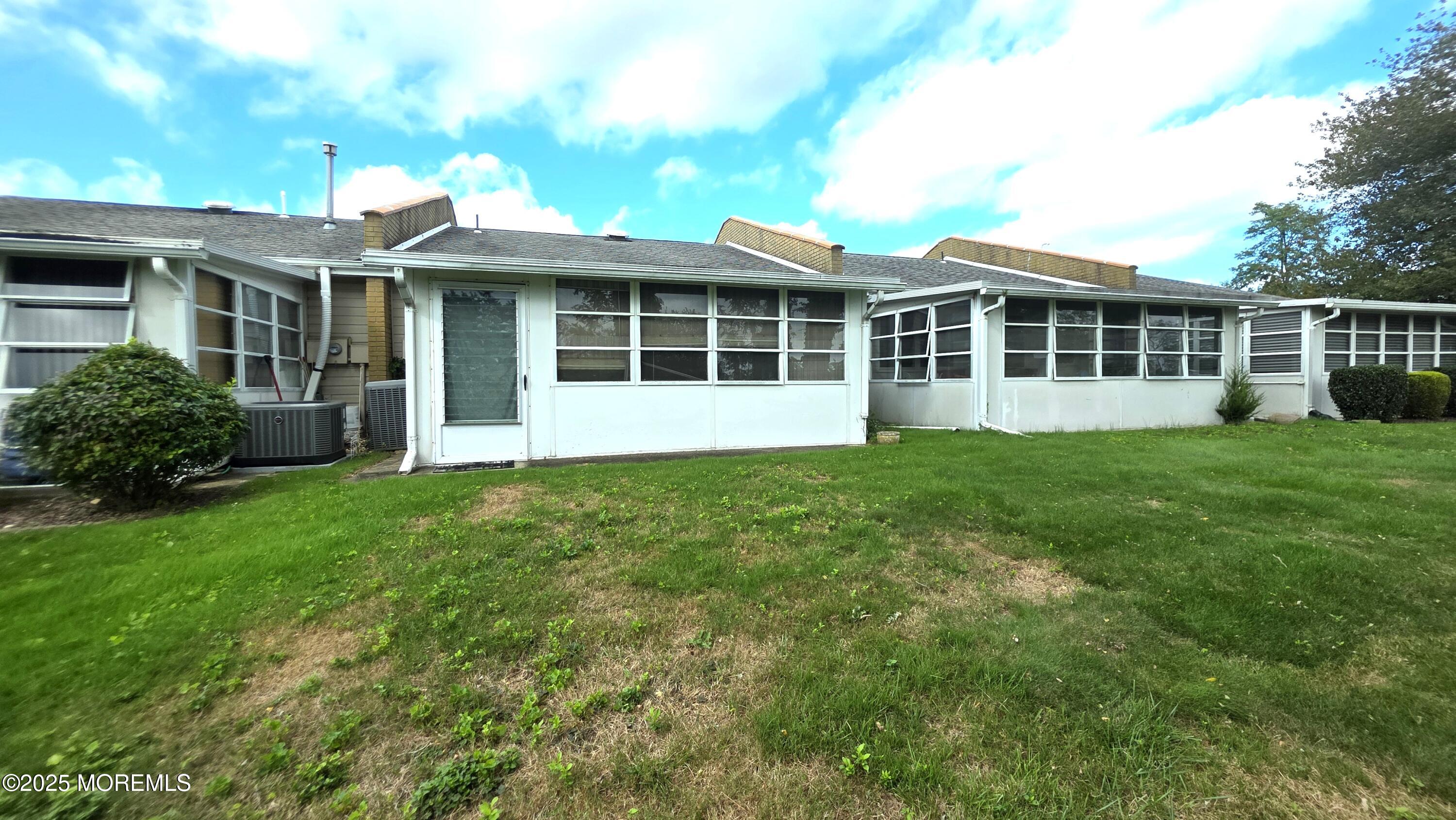 66 Breeze Court, Unit 97 Brick, NJ 08724 - Photo 17 of 18 a view of a house with a garden