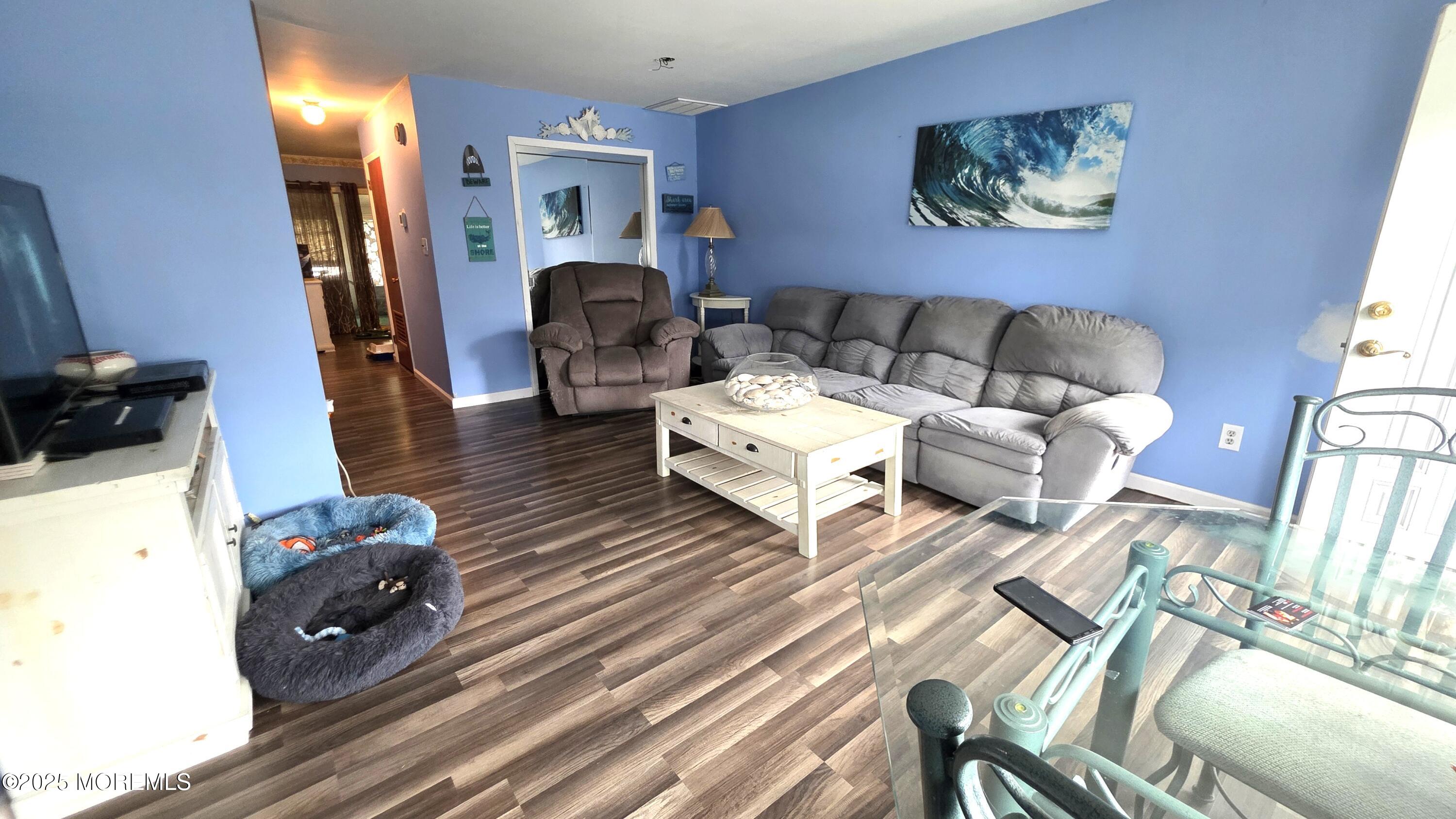 66 Breeze Court, Unit 97 Brick, NJ 08724 - Photo 4 of 18 a living room with furniture and a flat screen tv