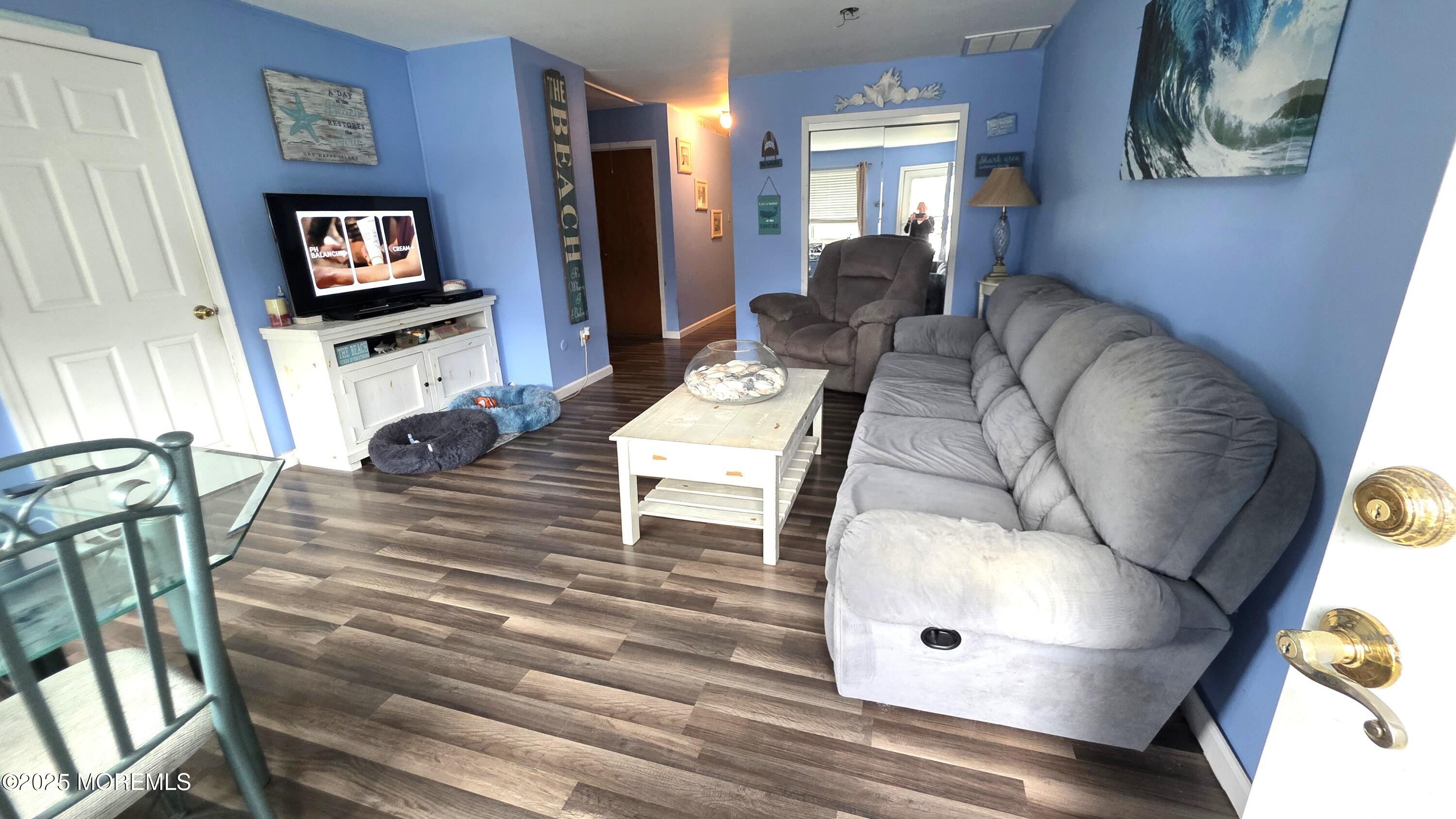 66 Breeze Court, Unit 97 Brick, NJ 08724 - Photo 5 of 18 a living room with furniture and a flat screen tv