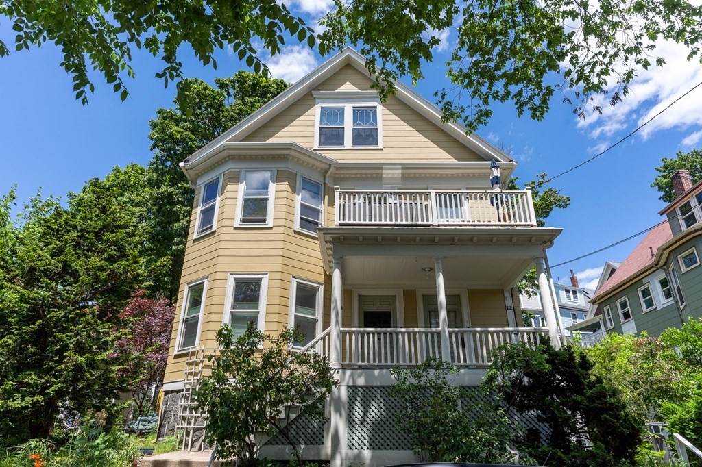10-12 Castlerock Street, Unit 2 Boston, MA 02125 - Photo 1 of 24 a front view of a house with a yard