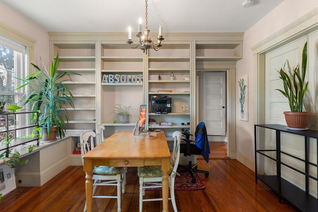 10-12 Castlerock Street, Unit 2 Boston, MA 02125 - Photo 5 of 24 a view of a dining room with furniture and wooden floor