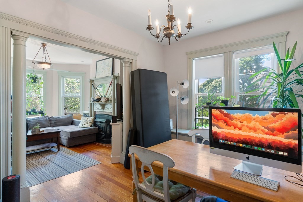 10-12 Castlerock Street, Unit 2 Boston, MA 02125 - Photo 6 of 24 a living room with furniture and a flat screen tv