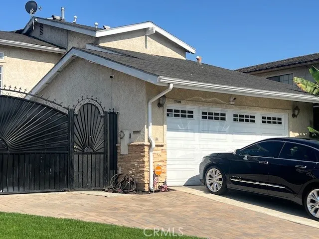 a view of cars parked in front of a house