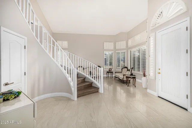 a view of a dining room with furniture and a potted plant