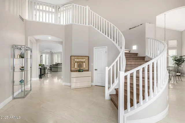 a kitchen with stainless steel appliances kitchen island granite countertop a sink and cabinets