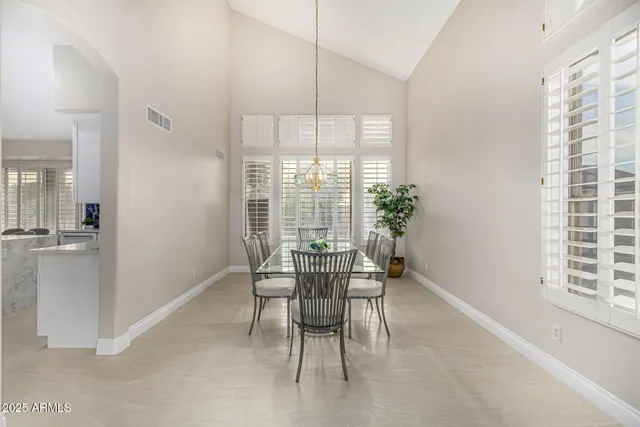 a spacious bathroom with a double vanity sink a mirror and a bathtub