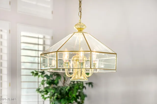 a living room with a bed furniture and a window