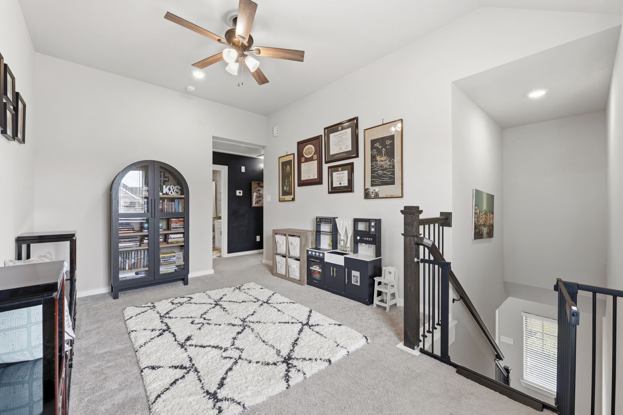 17696 Tree Of Heaven Conroe, TX 77385 - Photo 17 of 32 The upstairs loft offers flexible space that can be used as a play area, gaming, crafting, or an office.