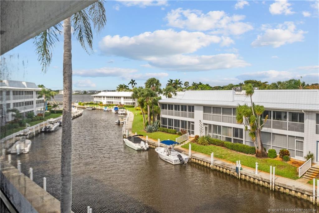 1864 Southwest Palm City Road, Unit 303 Stuart, FL 34994 - Photo 24 of 26 a view of a city with lawn chairs