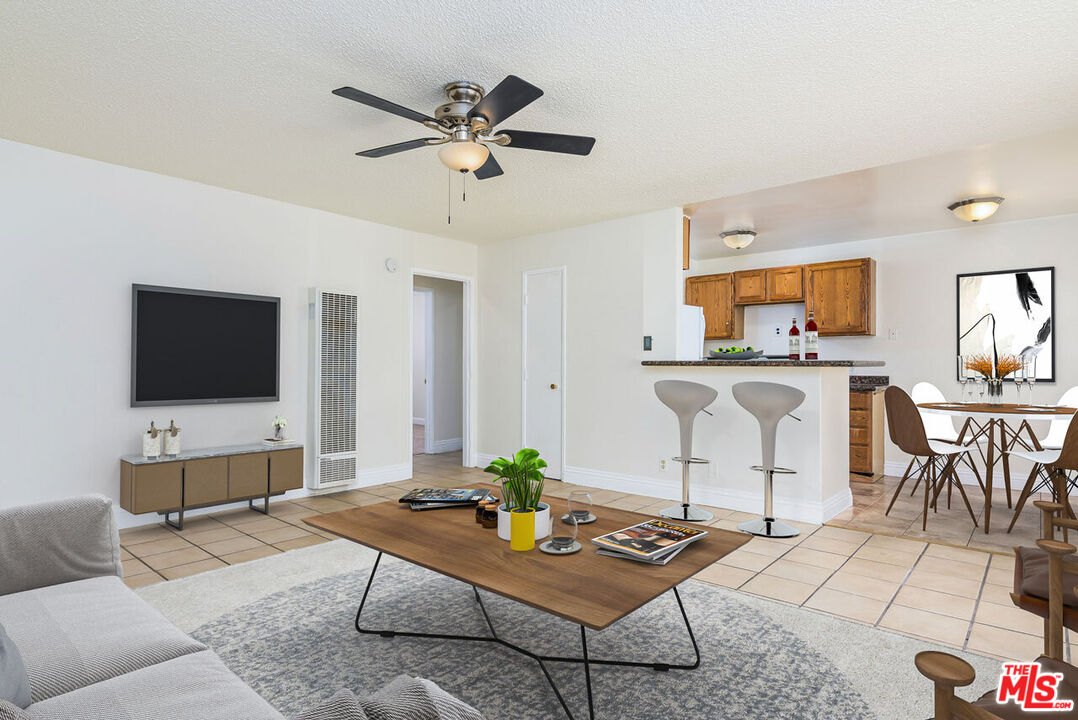 1920 North H Street, Unit 246 Oxnard, CA 93036 - Photo 1 of 31 a living room with furniture and a flat screen tv