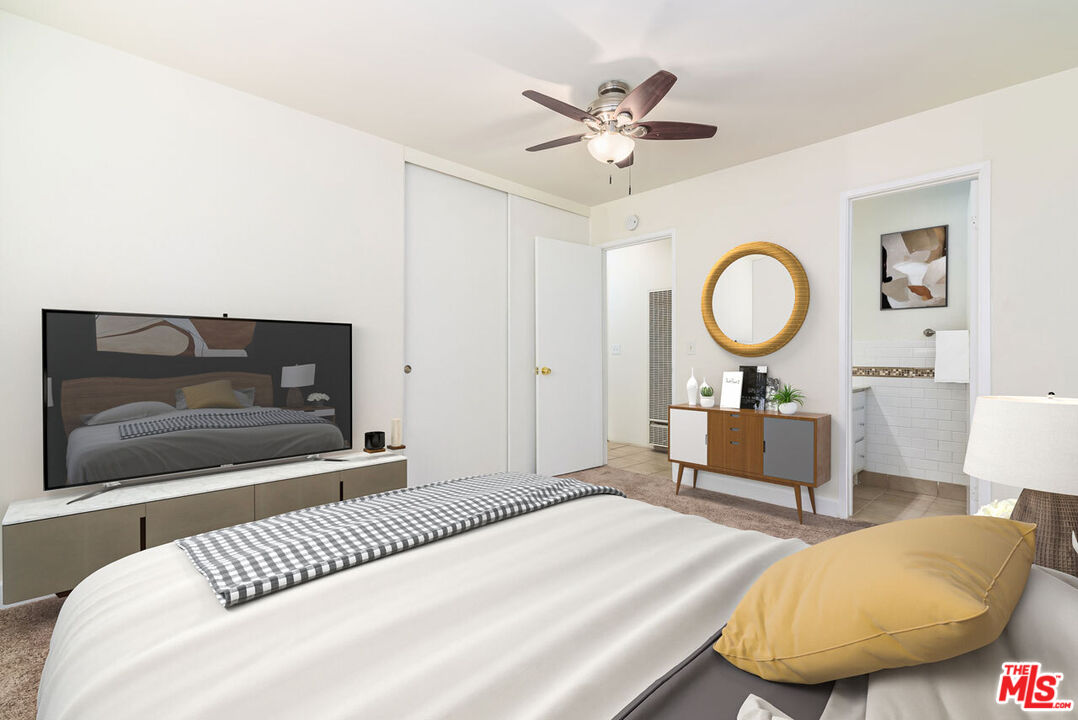 1920 North H Street, Unit 246 Oxnard, CA 93036 - Photo 12 of 31 a bedroom with a bed and a chandelier