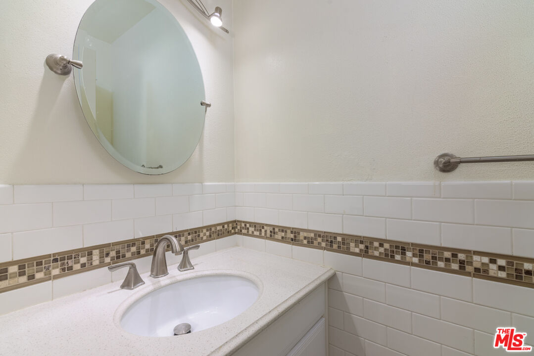 1920 North H Street, Unit 246 Oxnard, CA 93036 - Photo 18 of 31 a bathroom with a sink and a mirror
