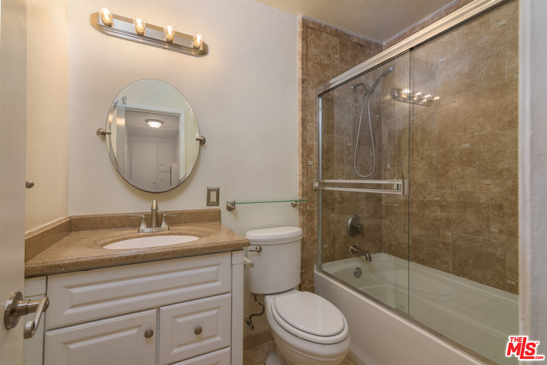 1920 North H Street, Unit 246 Oxnard, CA 93036 - Photo 19 of 31 a bathroom with a sink a toilet and shower