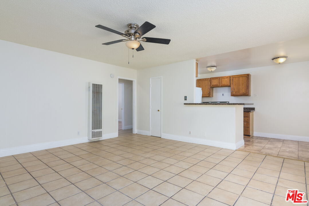 1920 North H Street, Unit 246 Oxnard, CA 93036 - Photo 2 of 31 a view of a kitchen with wooden floor and chandelier