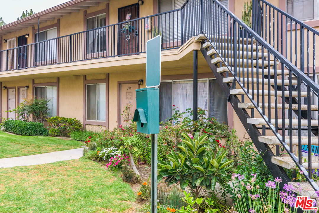 1920 North H Street, Unit 246 Oxnard, CA 93036 - Photo 21 of 31 a view of potted plants next to a building
