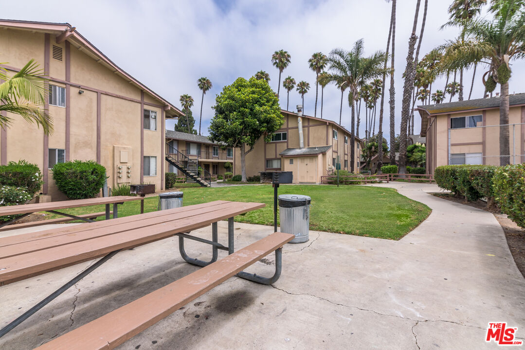 1920 North H Street, Unit 246 Oxnard, CA 93036 - Photo 25 of 31 a view of a two chair and tables in the patio