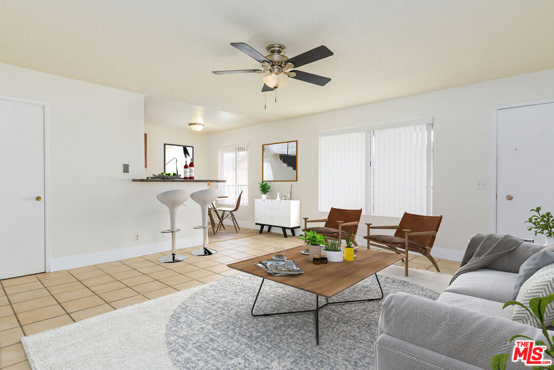 1920 North H Street, Unit 246 Oxnard, CA 93036 - Photo 3 of 31 a living room with furniture and a table