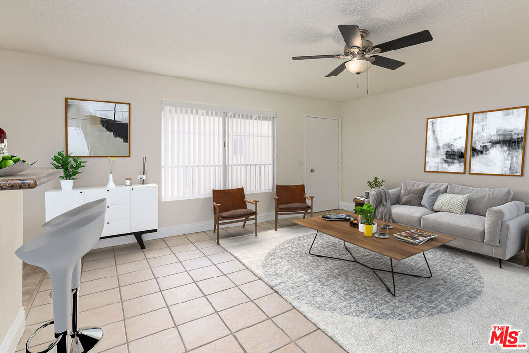 1920 North H Street, Unit 246 Oxnard, CA 93036 - Photo 5 of 31 a living room with furniture and a window