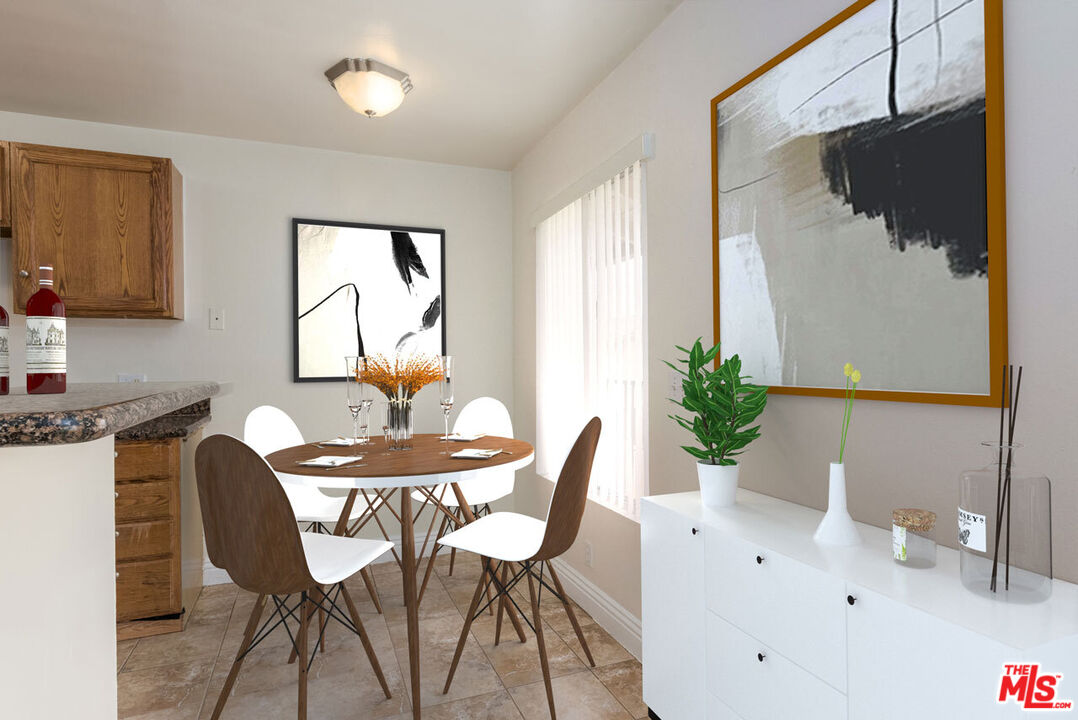 1920 North H Street, Unit 246 Oxnard, CA 93036 - Photo 7 of 31 a view of a dining room with furniture window and outside view