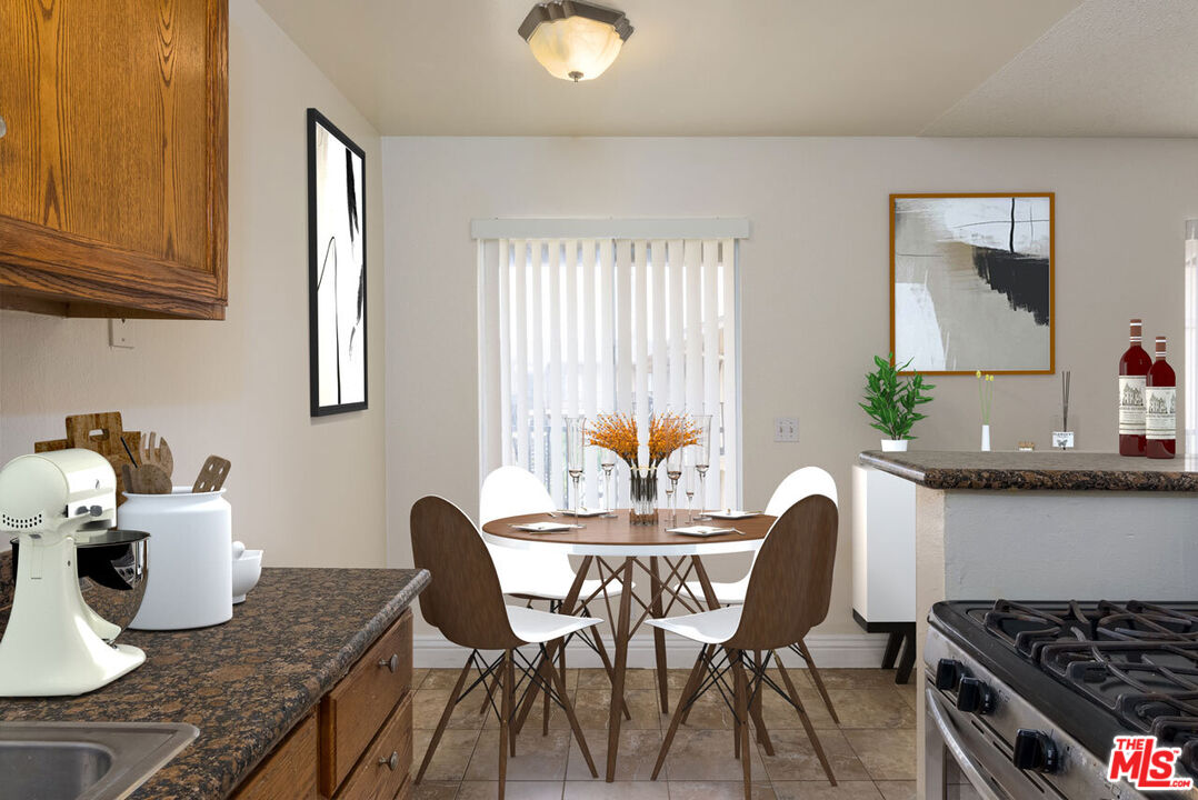 1920 North H Street, Unit 246 Oxnard, CA 93036 - Photo 9 of 31 a dining room with furniture and wooden floor