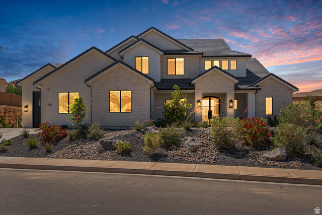 1192 East Corral Way Washington, UT 84780 - Photo 4 of 81 Contemporary two-story residence featuring light-toned stucco and stone veneer accents
