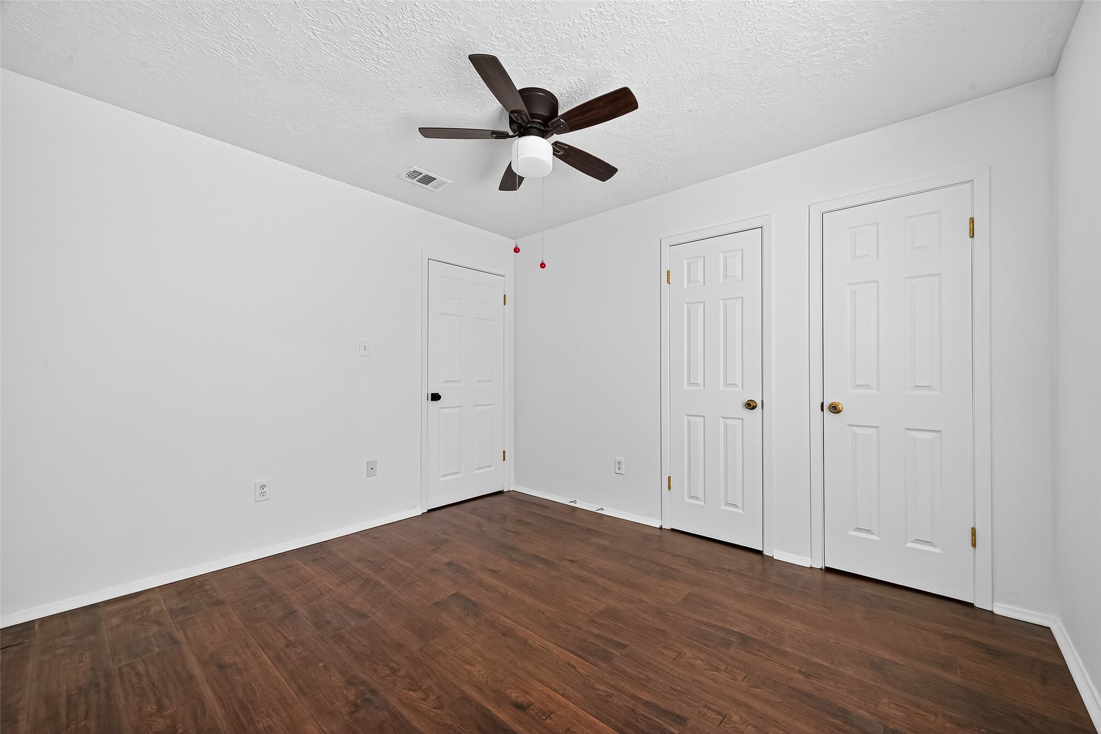 12910 Aste Lane Houston, TX 77065 - Photo 22 of 37 a view of empty room with wooden floor