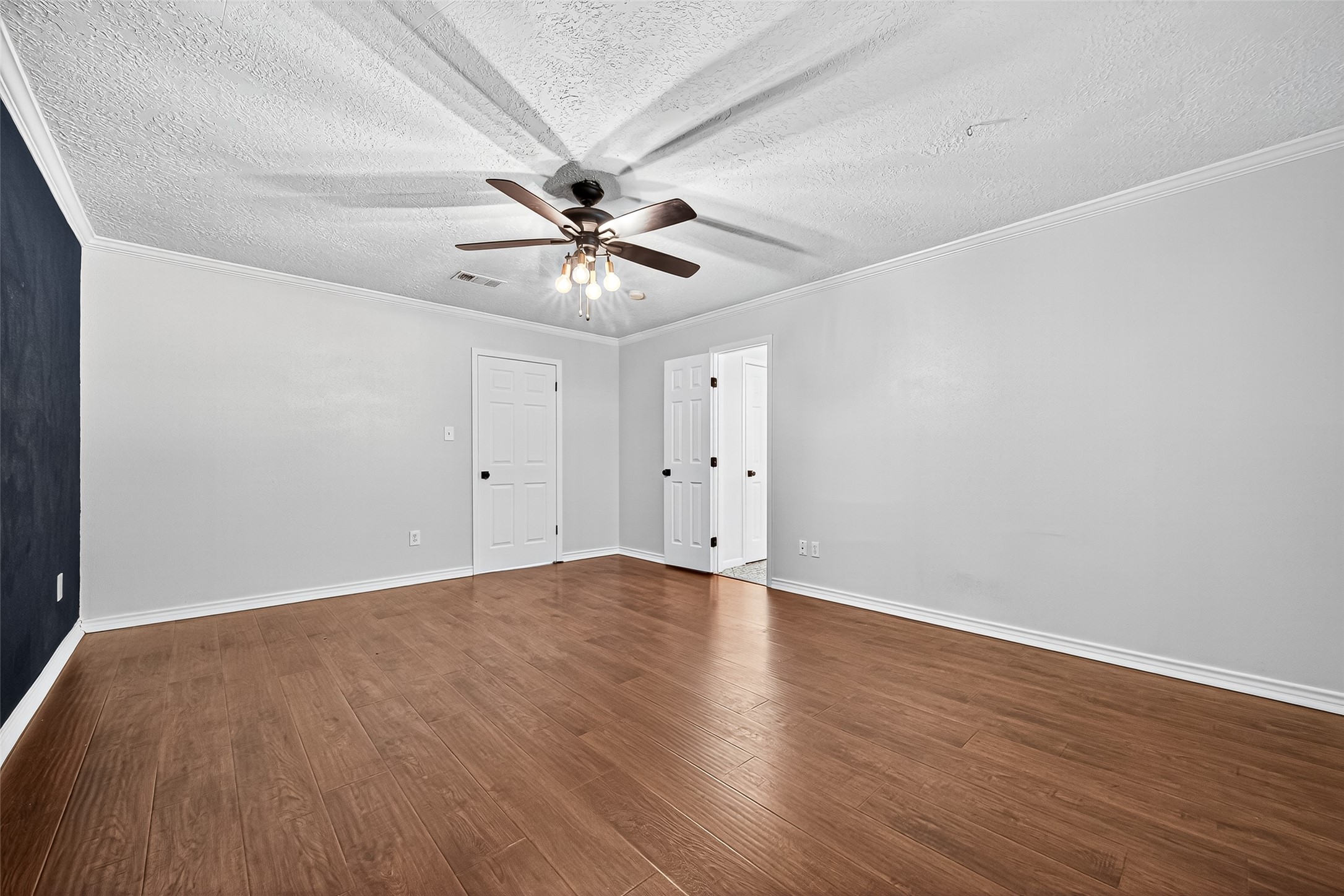 12910 Aste Lane Houston, TX 77065 - Photo 28 of 37 a view of an empty room with wooden floor