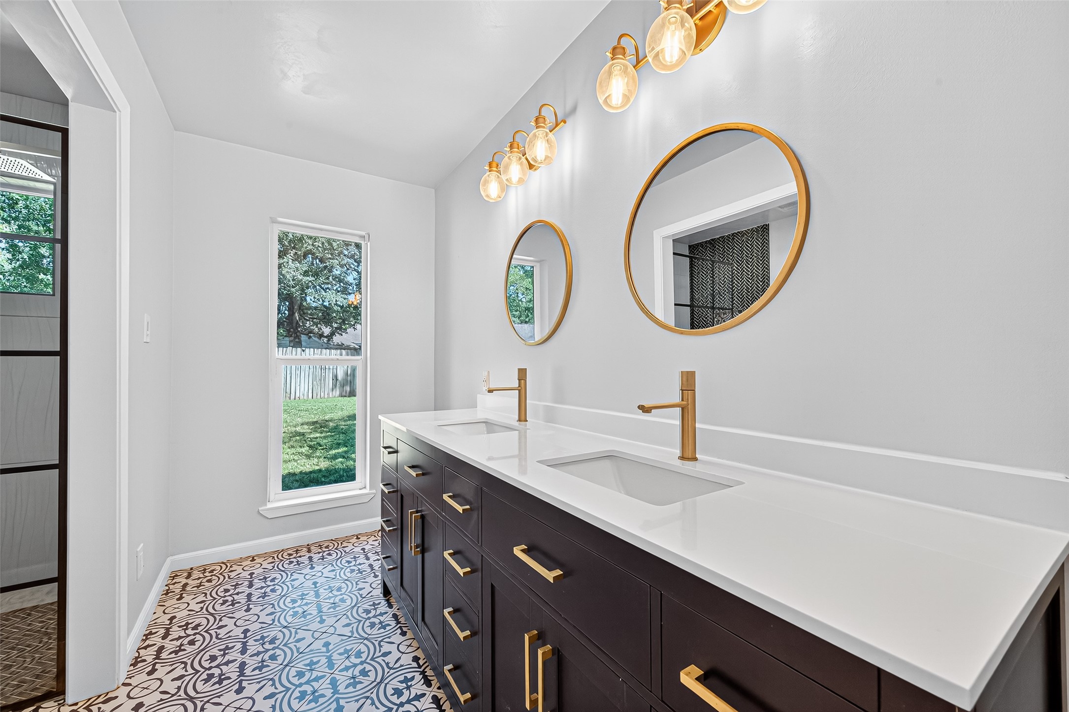 12910 Aste Lane Houston, TX 77065 - Photo 29 of 37 a bathroom with a sink and a vanity