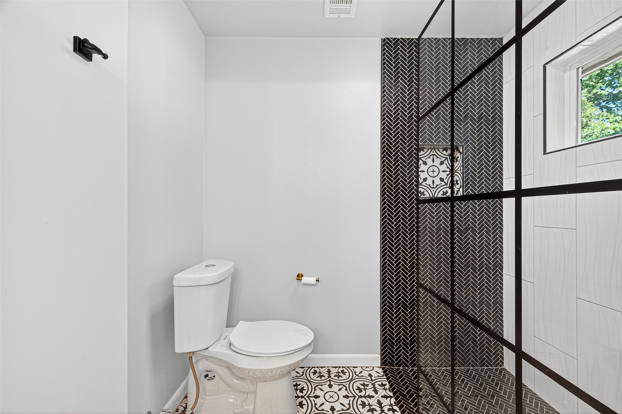 12910 Aste Lane Houston, TX 77065 - Photo 31 of 37 a bathroom with a toilet and a shower