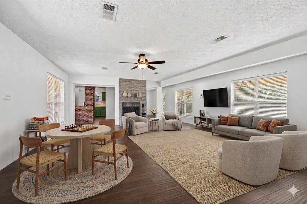 12910 Aste Lane Houston, TX 77065 - Photo 6 of 37 a living room with fireplace furniture and a flat screen tv