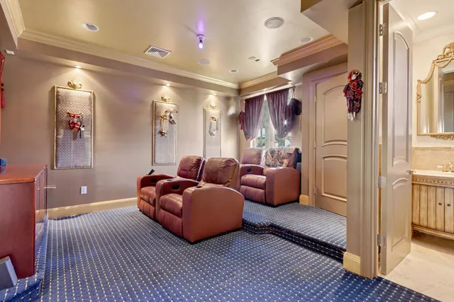 a bedroom with furniture large window and wooden floor