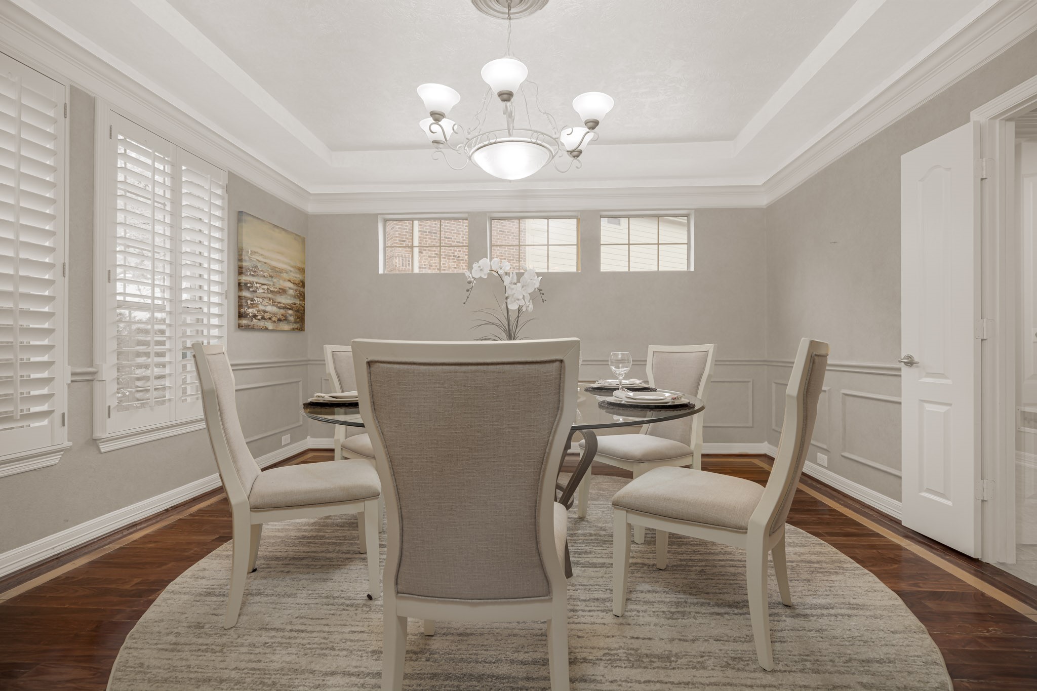 6506 Monte Bello Ridge Lane Houston, TX 77041 - Photo 4 of 39 Step into elegance with this formal dining room featuring rich wood flooring and stylish plantation shutters.