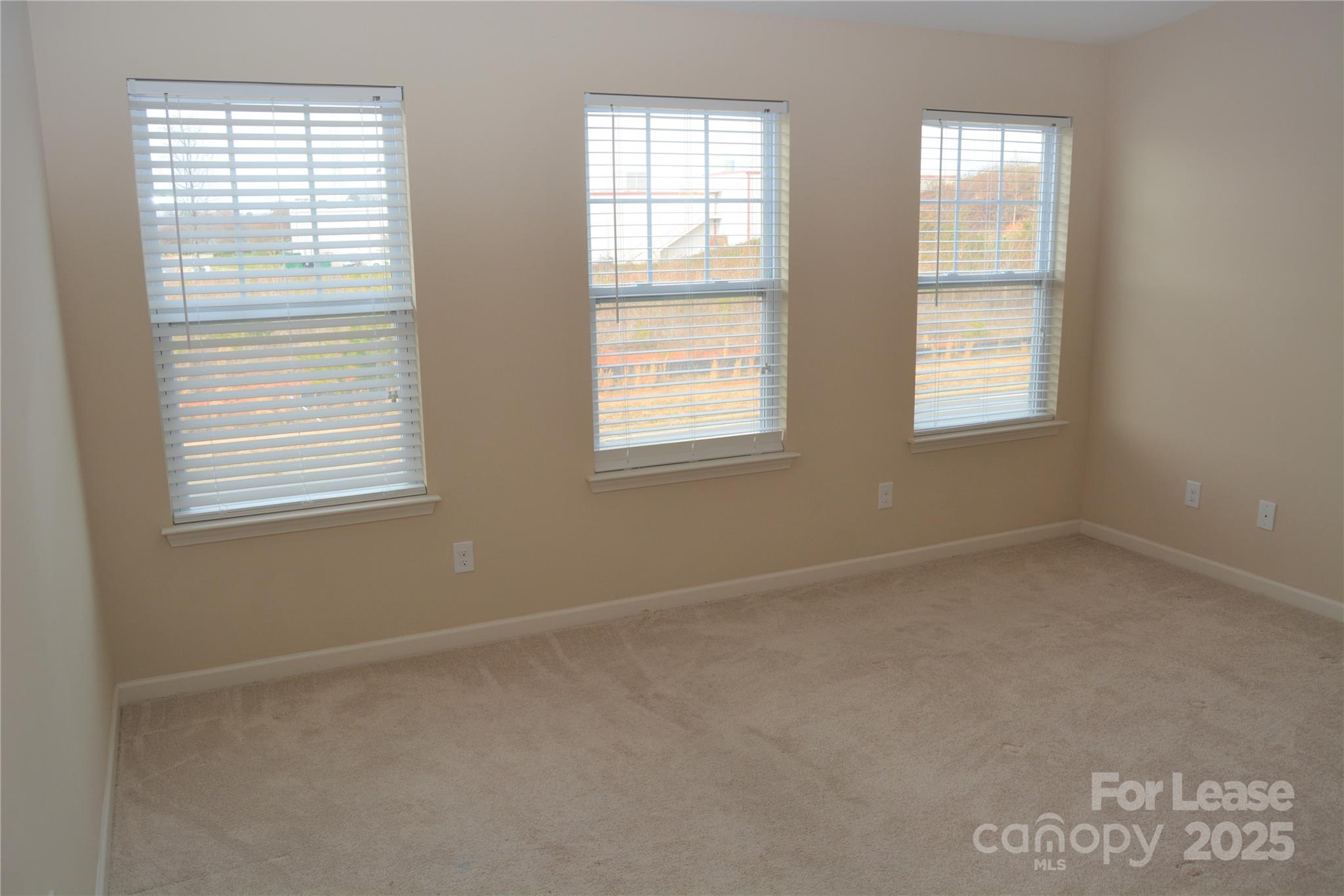 5212 Prosperity Church Road Charlotte, NC 28269 - Photo 5 of 5 an empty room with windows