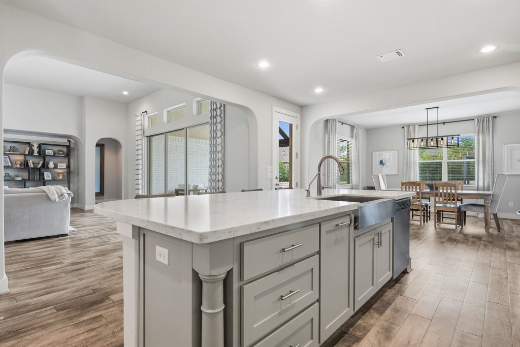 191 Tabago Court Austin, TX 78737 - Photo 39 of 40 a kitchen with counter top space sink and center island