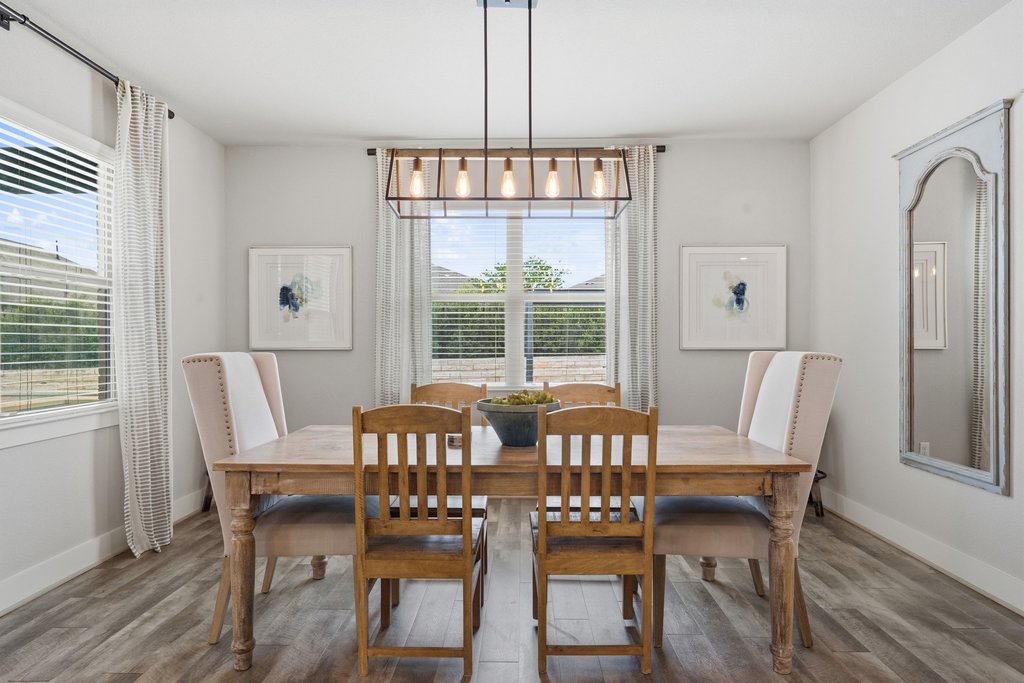191 Tabago Court Austin, TX 78737 - Photo 14 of 40 a view of a dining room with furniture window and wooden floor