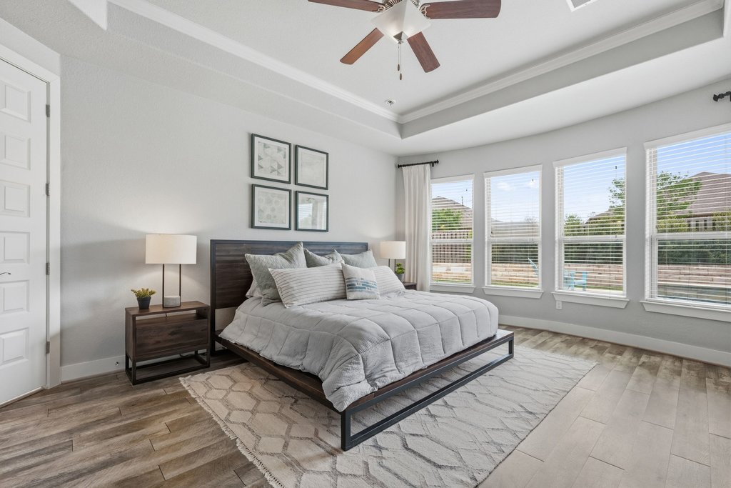 191 Tabago Court Austin, TX 78737 - Photo 15 of 40 a bedroom with a large bed and a large window