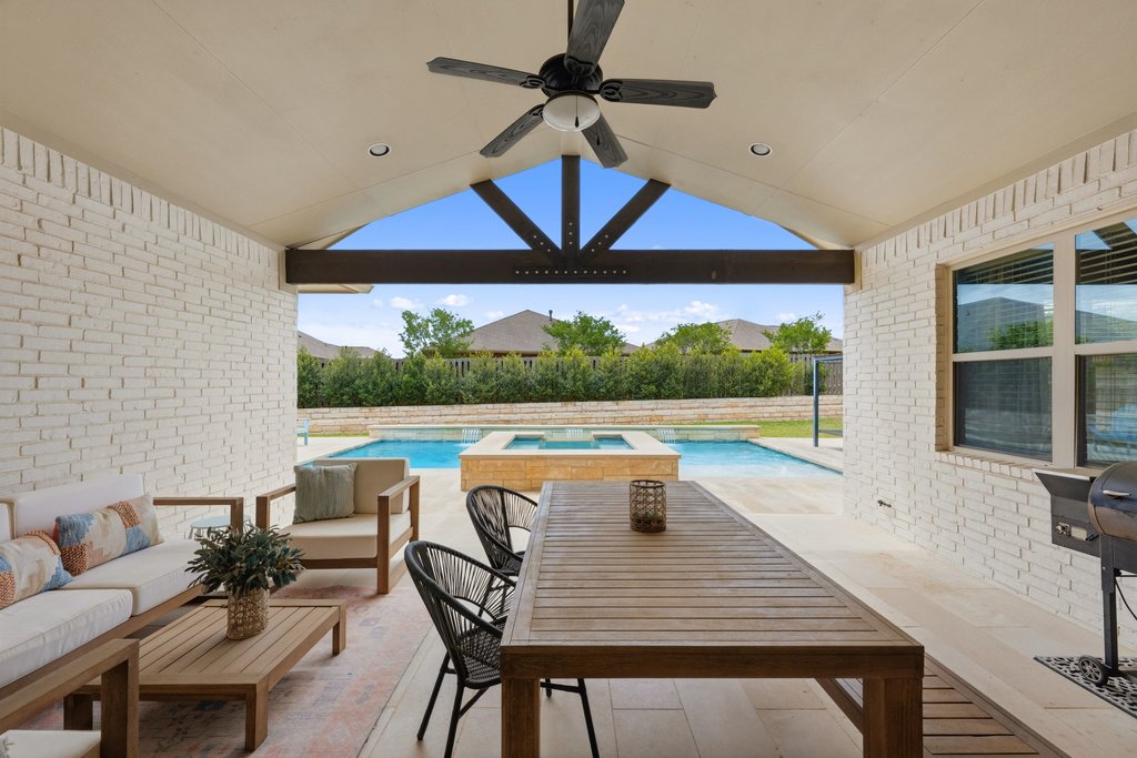 191 Tabago Court Austin, TX 78737 - Photo 2 of 40 a view of a patio with chairs and table in the patio