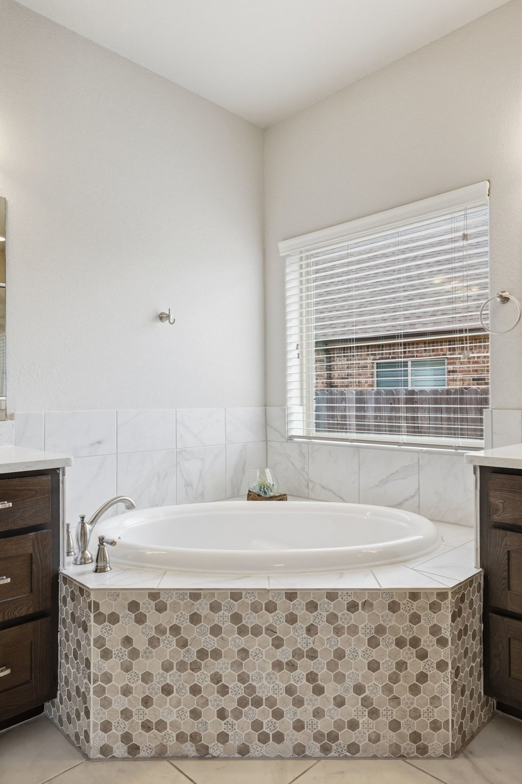 191 Tabago Court Austin, TX 78737 - Photo 19 of 40 a bathroom with a bathtub and window
