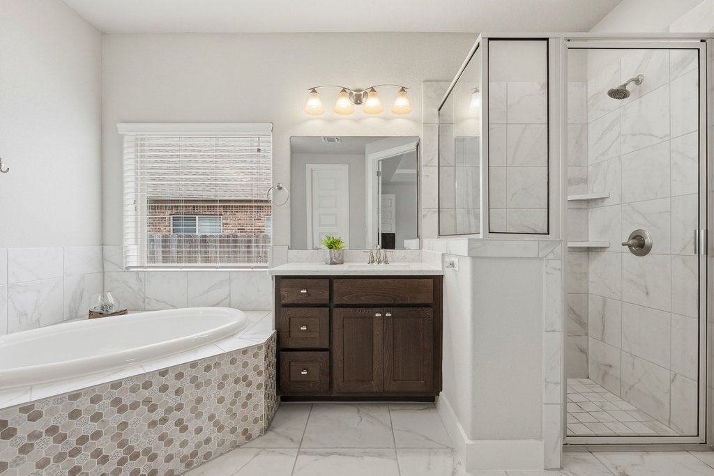 191 Tabago Court Austin, TX 78737 - Photo 20 of 40 a spacious bathroom with a tub sink shower and mirror