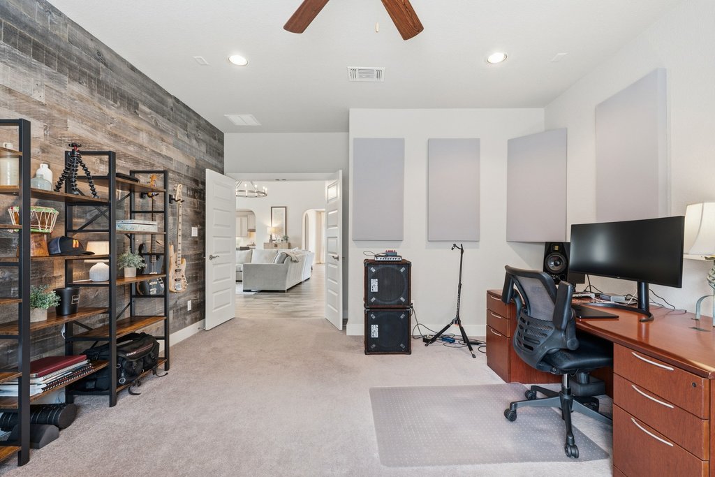 191 Tabago Court Austin, TX 78737 - Photo 27 of 40 a view of a livingroom with workspace and a window