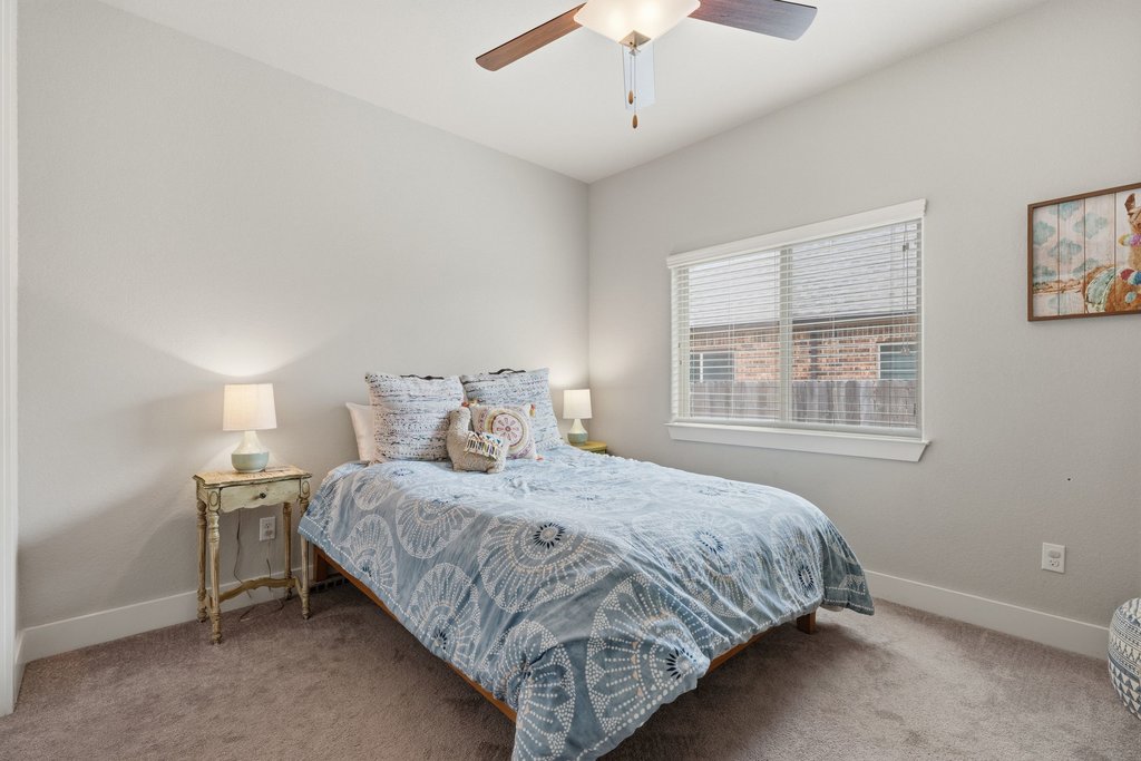 191 Tabago Court Austin, TX 78737 - Photo 28 of 40 a bedroom with a bed and a window