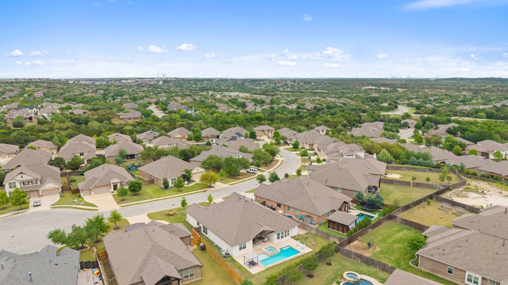 191 Tabago Court Austin, TX 78737 - Photo 34 of 40 an aerial view of residential houses with outdoor space and trees