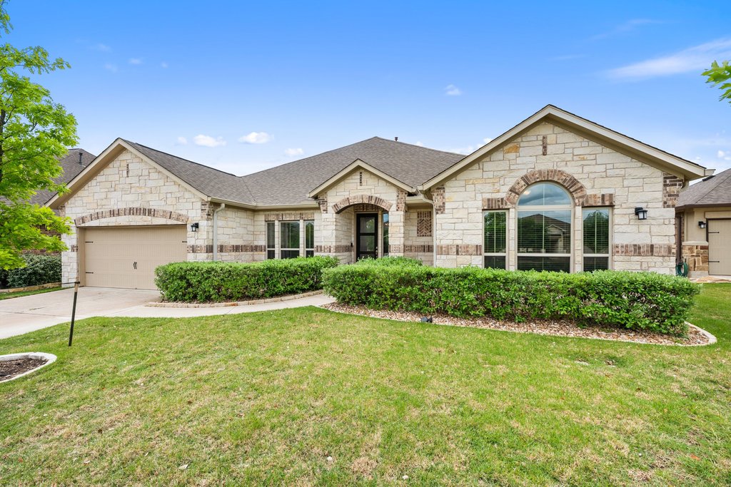 191 Tabago Court Austin, TX 78737 - Photo 35 of 40 a front view of a house with a yard