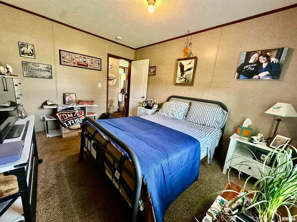 a bedroom with furniture and a bed