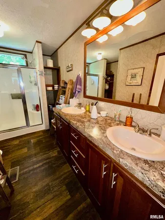 a bathroom with a sink and a mirror