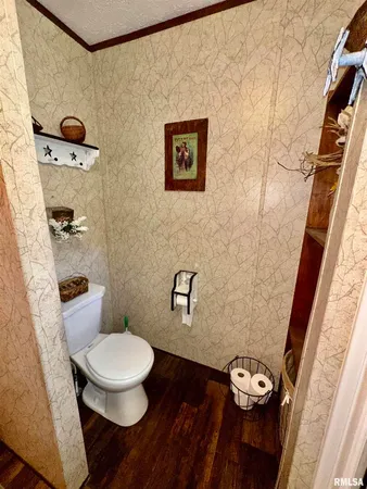 a white toilet sitting next to a bathroom sink